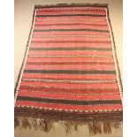 A 20th Century Flat-weave Carpet with red striped centre field with black & ivory woven bands in a