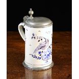 An 18th Century Tin-glazed Cream-ware Tankard with hinged pewter lid and foot mount.