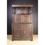 A 17th Century Style Carved Oak 'Tridarn' Cupboard in Two Sections.