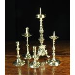 A Collection of Five Antique Brass Candlesticks; An Italian baroque pricket with spiralling,