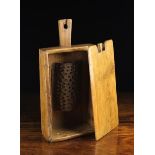 A 19th Century Bread Grater of pierced semi-cylindrical sheet iron affixed to the inside of a pine