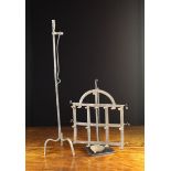 An 18th Century Wrought Iron Peerman with rolled Candle Socket and sprung rush holder on a tripod