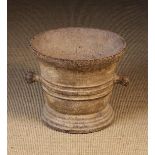 A Large 17th Century Cast Iron Mortar with protuberant knop handles either side.
