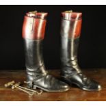 A Pair of Gentleman's Vintage Black Leather Hunting Boots on wooden trees with boot hooks and