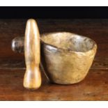 An 18th Century Rustic Dug Out Treen Pestle & Mortar with fabulous tactile ware to the surface.