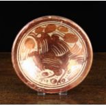 An 18th Century Hispano-Moresque Copper Pink Lustre Dish decorated with a bird,