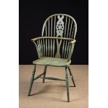 A 19th Century Pale Green Painted Wheel-back Windsor Armchair, 42" (107 cm) high, 21 " (53 cm) wide.