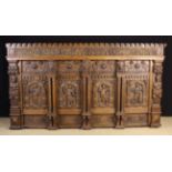 An Impressive 16th/ Early 17th Century Style Panelled Oak Overmantel enriched with carving.