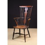 A 19th Century High Comb-backed Windsor Armchair.