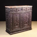 A 19th Century Renaissance Revival Side Cabinet enriched with elaborate carving and having a