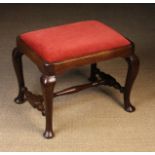 An Attractive George II Walnut Stool having an upholstered drop in seat standing on cabriole legs