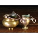 Two Brass Benitiers: One 18th Century with a ring turned bulbous bowl on a raised circular foot