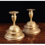 A Pair of 18th Century Scandinavian Brass Candlesticks with repoussé decoration.