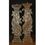 An Unusual Pair of 17th Century Silhouette Cut Staircase Spindles entwined with garlands of crested