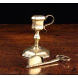 An 18th Century Brass Candle Snuffer & Stand with knopped stem and hexagonal base,