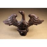 An 18th Century Wall Mounted Painted Wood Sculpture boldly carved in the form of a phoenix depicted