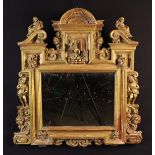 An 18th Century Italian Carved Giltwood Framed Mirror.