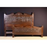 A 17th Century Style Carved Oak Bed.