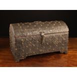 A 17th Century Italian Dome-topped Casket clad in decorative embossed sheet metal enhanced with