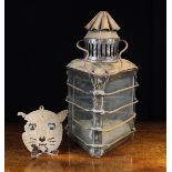 A 19th Century Oil Lantern of triangular form surmounted by a vented chimney with crimped conical