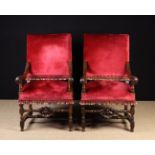 A Pair of 19th Century Carved Walnut Armchairs in the 17th century style.