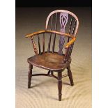 A 19th Century Child's Low Spat Nottinghamshire Windsor Armchair stamped with maker's name