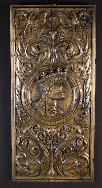 A Large Early 16th Century French Romayne Panel carved with a profiled head of a king in a turned