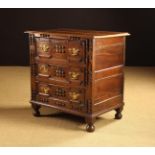 A Small 17th Century & Later Fruitwood & Yew Chest of Drawers with decorative mouldings.
