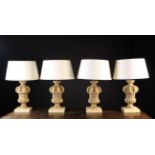 A Set of Four Carved Bare Oak Lamps with bulbous,