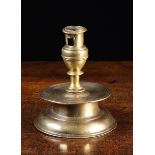 A 17th Century German Brass Candlestick (A/F) with lateral cut apertures to the socket above a