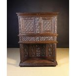 A Small 16th Century & Later Oak Dressoir richly carved with Gothic tracery and having two doors