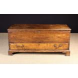An 18th Century Oak Mule Chest. The plank lid with applied edge moulding on iron strap hinges.