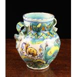 A 19th Century Maiolica Twin-handled Vase decorated in turquoise green, blue, yellow,