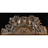 A Pierced & Carved Walnut Pediment emblazoned with a flaming heart within a moulded demi-lune panel