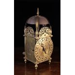 A Late 17th Century Brass Lantern or Chamber Clockwith pierced chaptr ring and single hour hand.