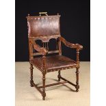 A 19th Century Oak Armchair with padded leather back panel,