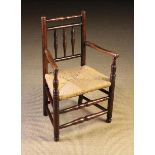 A Late 18th/Early 19th Century Child's Rush Seat Spindle-back Armchair.