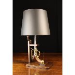 A Novelty Table Lamp incorporating an upturned flintlock pistol mounted on a mahogany base fitted