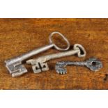 Three Gothic Wrought Iron Keys, 6½" (16.5 cm), 5¾" (14.5 cm) and 4" (10 cm) in length.