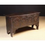 A Late 17th/Early 18th Century Boarded Oak Coffer. The lid with incised edge moulding.