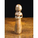 A Primitive Carved Treen Stump Doll, 8¾" (22 cm) in length.