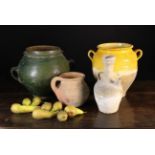 Four Earthenware Pots: A 19th century French confit pot with semi ochre glazed 12" (31 cm) in