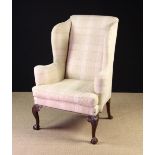 A High Wing-Backed Upholstered Arm Chair in the Early Georgian Style,