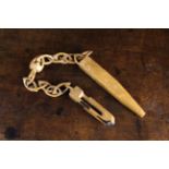 A Simple 19th Century Beechwood Knitting Sheath on a wooden chain carved from one piece of timber