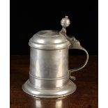 An 18th Century Pewter Bootmakers' Guild Tankard dated 1717, 8 ins (20.5 cms) in height.