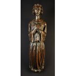 A Relief Carved Wood Sculpture of an angel dressed in a flowing robe with hands crossed over chest,