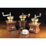 Three Vintage Brass Coffee Grinders; each having a wooden box form base with brass knopped drawer.