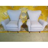 A pair of Italian mid century arm chairs with stylish and elegant proportions and extremely