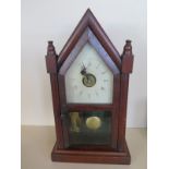 An American Gothic mahogany 36 hour mantle clock, 39cm tall, in running order, some wear to dial