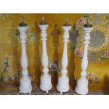 Four shabby chic wooden 19th Century style lamp bases, later painted, each 105cm H